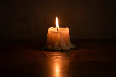 Burning Candle of Faith in Darkness