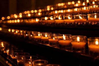 Burning Votive Candles in Quiet Faith