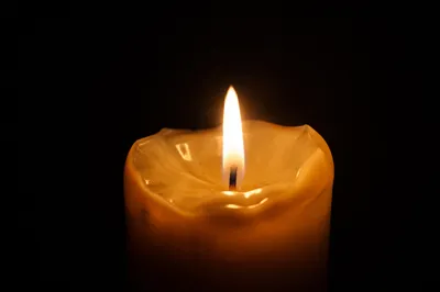Burning Candle of Hope in Darkness