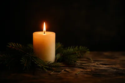 Burning Candle with Evergreen Faith Glow