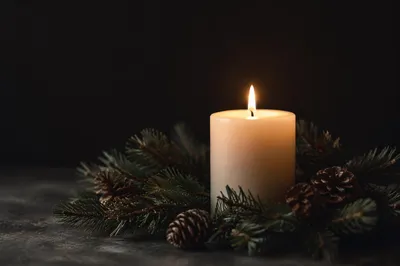Burning Ivory Candle with Evergreen Wreath