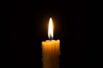 Burning Candle in Darkness for Faith
