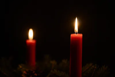 Red Advent Candles in Quiet Faith