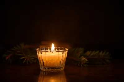 Burning Candle for Quiet Evergreen Faith