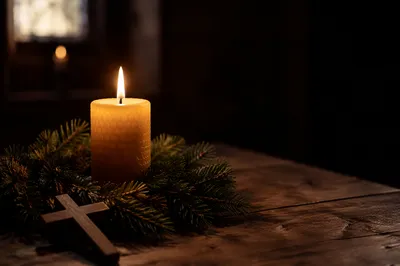 Burning Candle with Evergreen Faith Cross