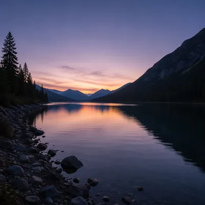 Calm Morning Lake Reflection with Evergreen Mountains
