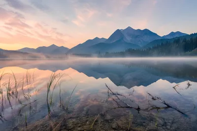 Calm Alpine Lake Reflection at Sunrise