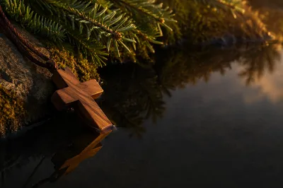 Wooden Cross Reflected in Still Water