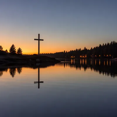 Wooden Cross Reflected on Calm Evergreen Lake