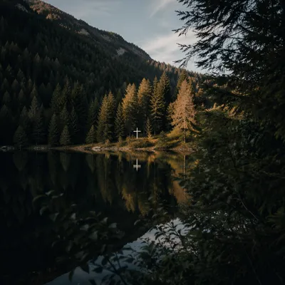 White Cross Reflected in Still Mountain Lake