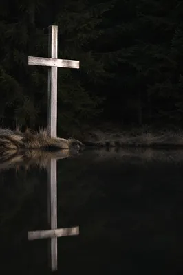 Wooden Cross Reflected in Still Pond