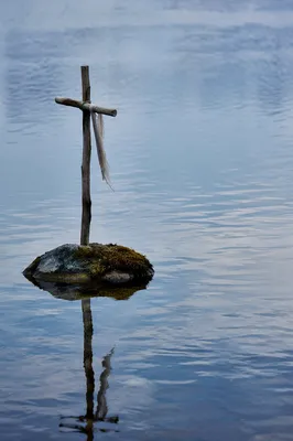 Weathered Cross Reflected in Still Water