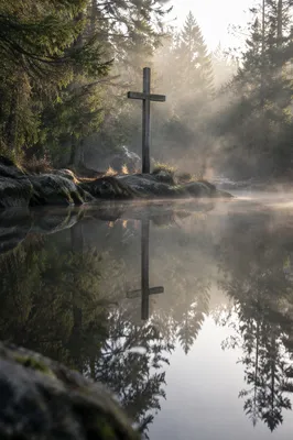 Wooden Cross Reflected in Misty Forest Pond