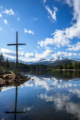 Wooden Cross Reflected on Evergreen Lake