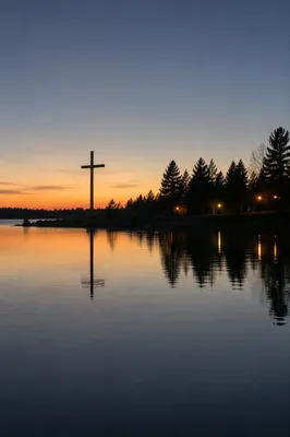 Wooden Cross Reflected on Evergreen Lake