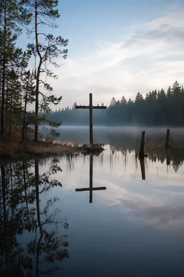 Weathered Cross Reflected on Evergreen Lake