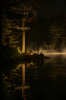Illuminated Cross Reflected in Still Water