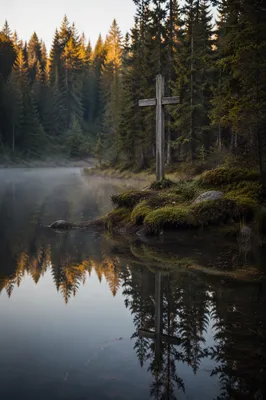 Wooden Cross Reflected in Alpine Pond