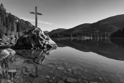 Wooden Cross Reflected in Mountain Lake