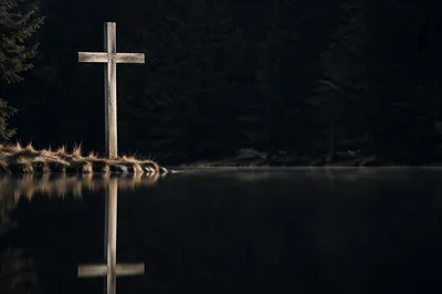 Wooden Cross Reflected in Still Evergreen Pond