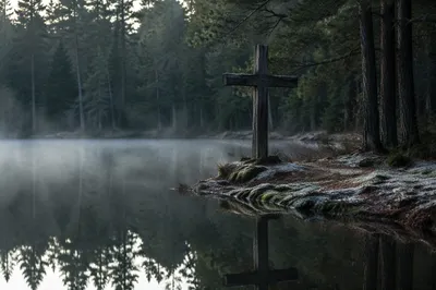 Wooden Cross Reflected in Evergreen Pond