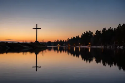 Wooden Cross Reflected on Evergreen Lake
