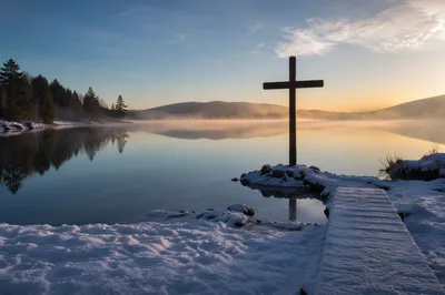 Wooden Cross Reflected on Winter Lake