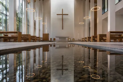 Wooden Cross Reflected in Chapel Pool