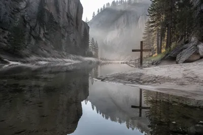 Wooden Cross Reflected in Quiet Canyon Water