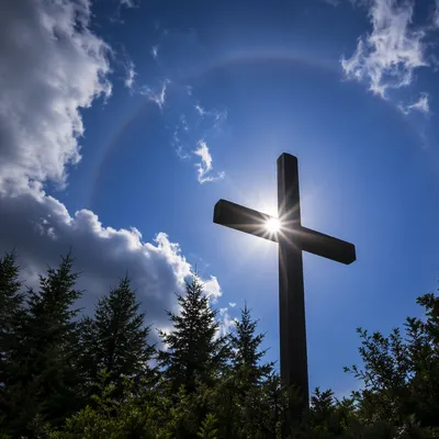 Wooden Cross with Radiant Sunburst Sky