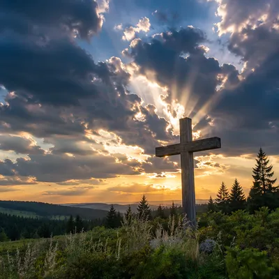 Wooden Cross Beneath Golden Light Rays