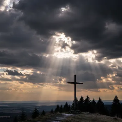 Wooden Cross Beneath Dramatic Storm Light Rays