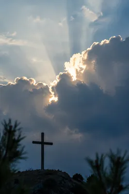 Wooden Cross Beneath Dramatic Light Rays