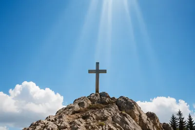 Weathered Cross Beneath Gentle Sunbeams