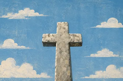 Weathered Stone Cross Under Blue Sky