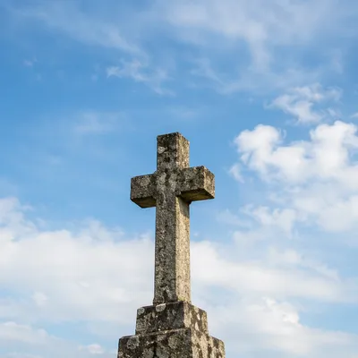 Empty Stone Cross Under Blue Sky
