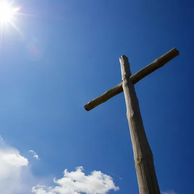 Empty Wooden Cross Beneath Blue Sky