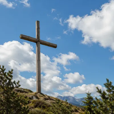 Wooden Cross Beneath Blue Cloudy Sky