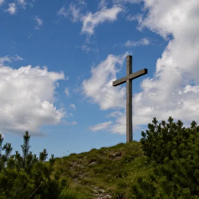 Wooden Cross Under Blue Cloudy Sky