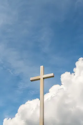 Pale Wooden Cross Beneath Blue Sky