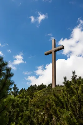 Wooden Cross Beneath Blue Clouded Sky