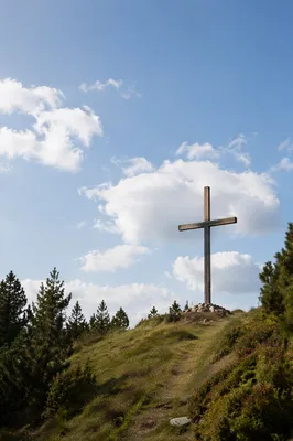 Wooden Cross on Blue Sky Hillside