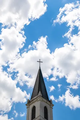 Empty Cross Above Chapel Steeple Sky