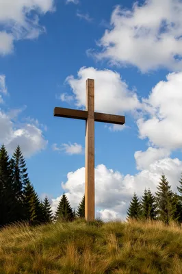Empty Wooden Cross Under Blue Sky