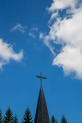 Empty Wooden Cross Beneath Blue Sky