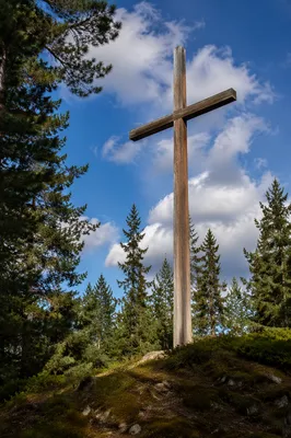 Empty Wooden Cross Beneath Blue Sky