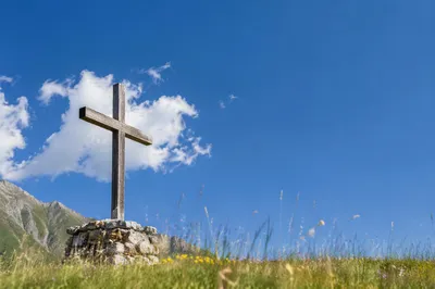 Empty Wooden Cross Under Blue Sky