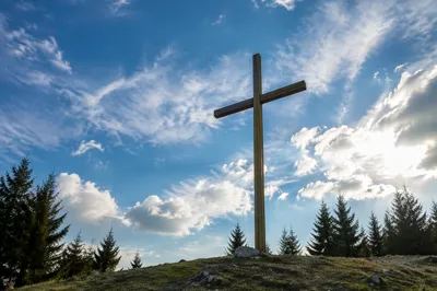 Empty Wooden Cross Under Blue Sky