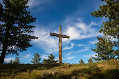 Empty Wooden Cross Under Blue Sky