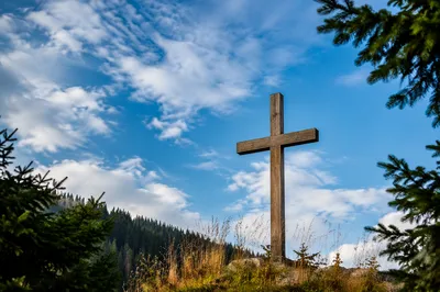 Empty Wooden Cross Under Blue Sky